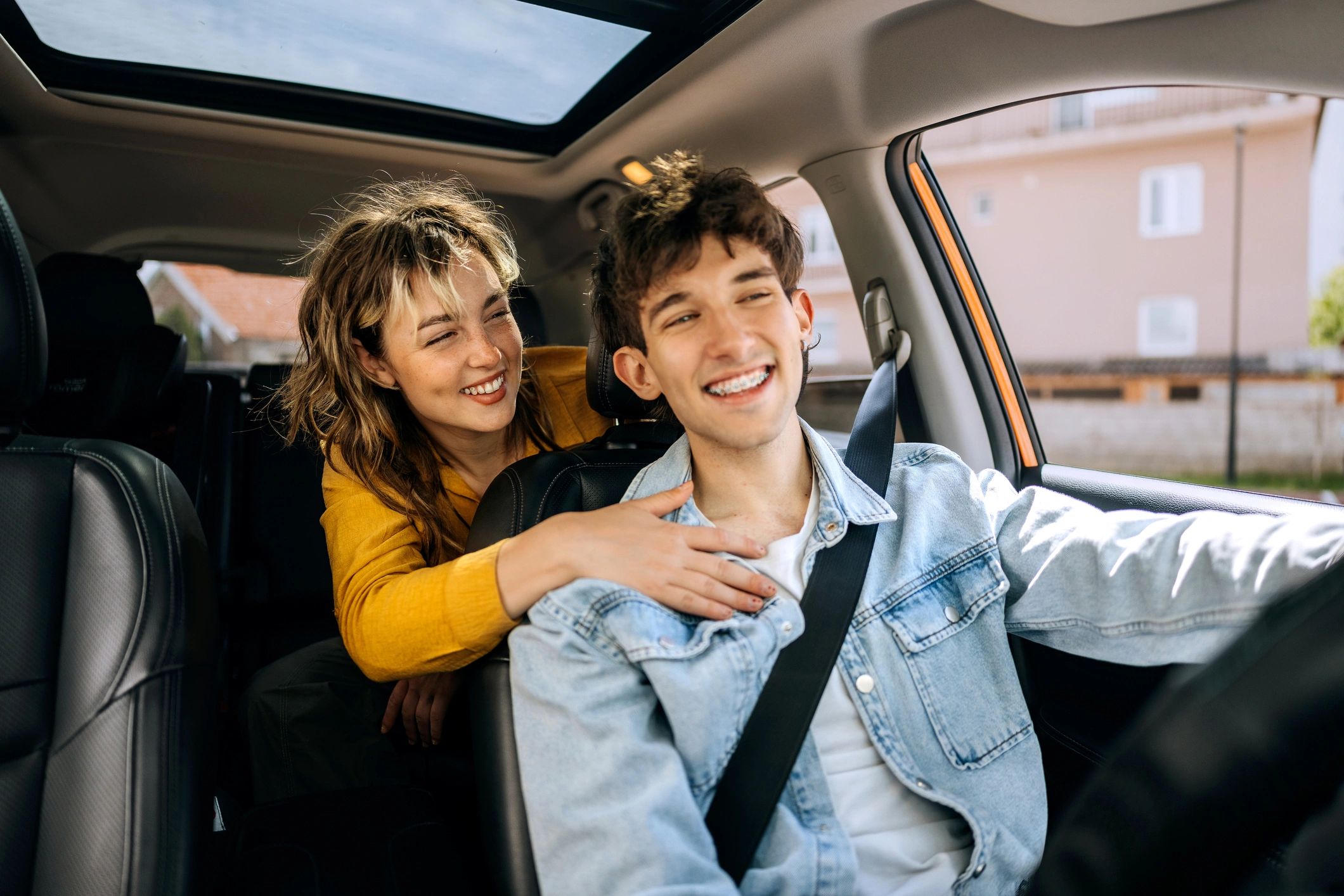 Smiling couple in a car